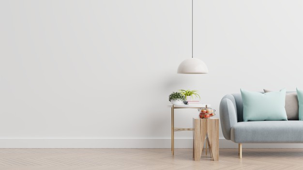 empty-living-room-with-blue-sofa-plants-table-empty-white-wall-background-3d-rendering_41470-1782
